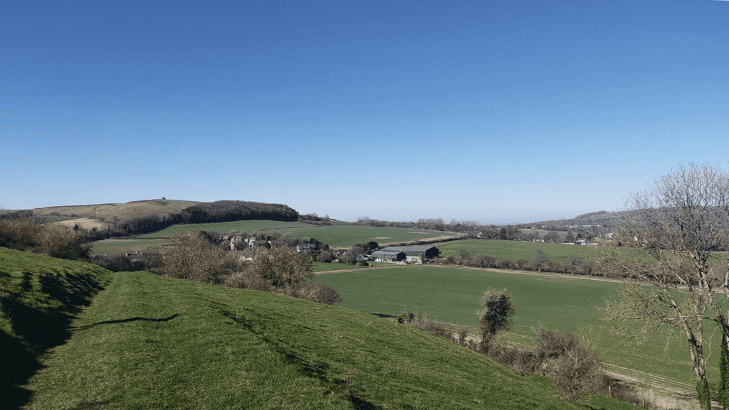 On Dorset Walks looking north across Melcombe Bingham to Nordon Hill and the Dorsetshire Gap 